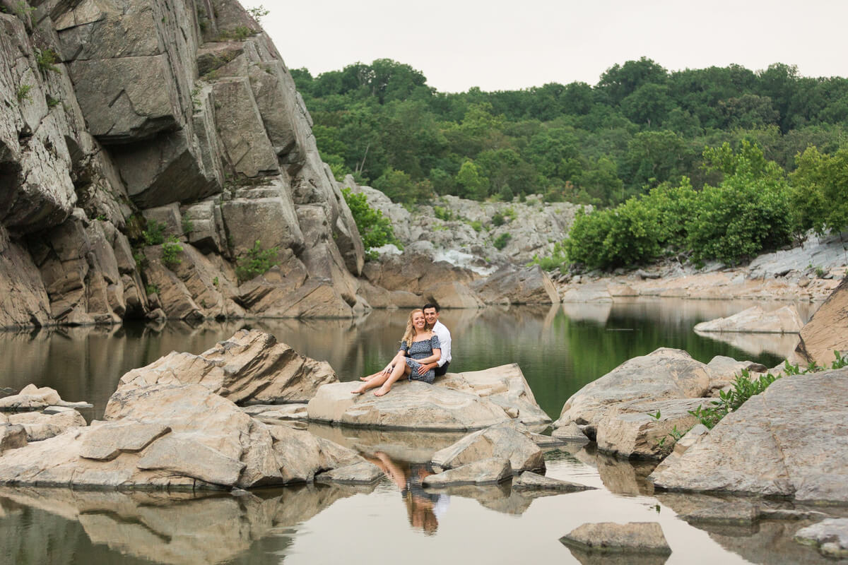 Couple sitting on rocks at Great Falls