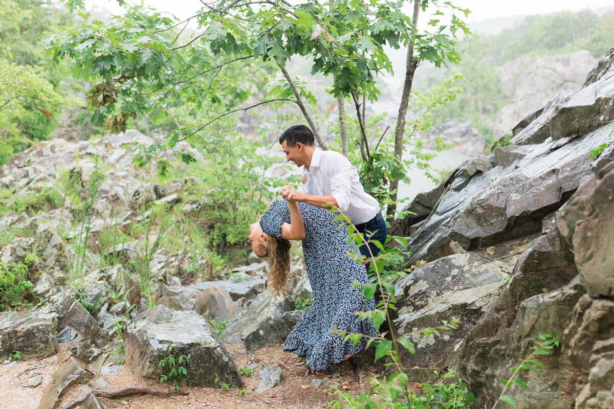 Couple dancing in the rain during engagement session