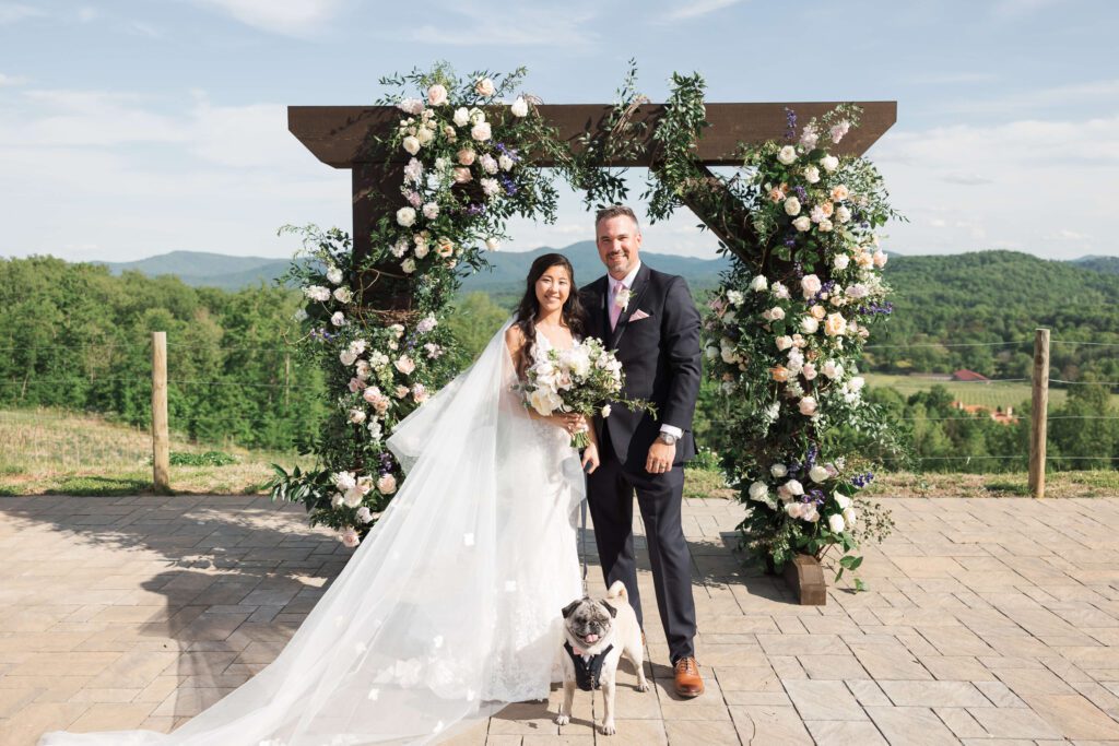 Hazy Mountain Vineyard spring wedding outdoor ceremony with floral arch